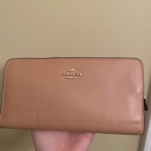 Tan leather Coach wallet.
